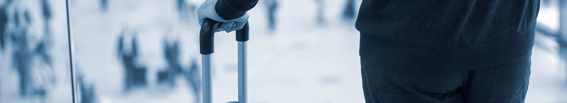 Photo of a businessman holding a suitcase